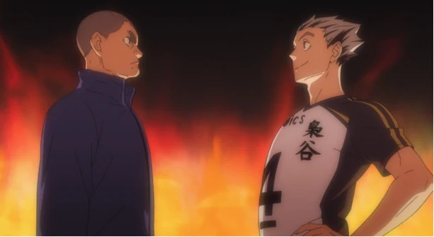 Wakatsu Kiryu and Kotaro Bokuto facing each other in front of flames in the Where Monsters Go PV